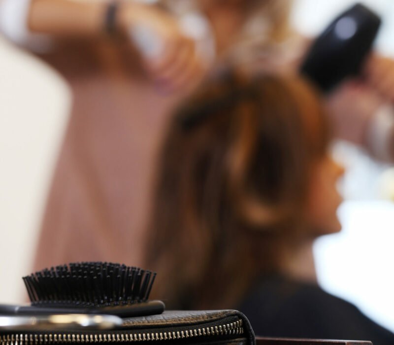 Hairdresser salon. Woman during haircut